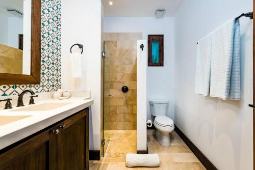 a bathroom with a sink and a toilet at Plaza Carlota 2 At Las Catalinas in Playa Danta