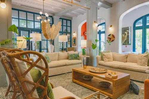 a living room with couches and a coffee table at Plaza Carlota 2 At Las Catalinas in Playa Danta