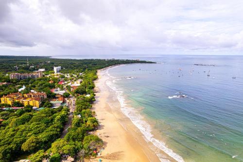 an aerial view of a beach and the ocean at Sunrise 6- Ocean View 2 Br Condo, Steps To The Beach in Tamarindo