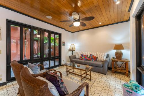 a living room with a couch and a table at Villa Cerca Del Mar #6- 3Br House With Pool in Tamarindo