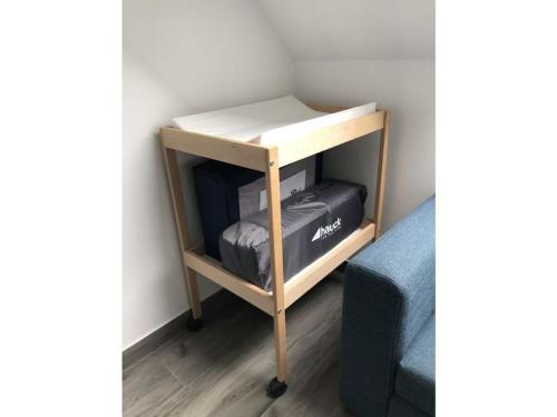 a small desk with a bed in a room at Fehnhuus Comfortable holiday residence in Timmel
