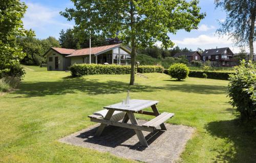 a picnic table in a yard with a tree at Lovely Home In Højslev With Wifi in Højslev