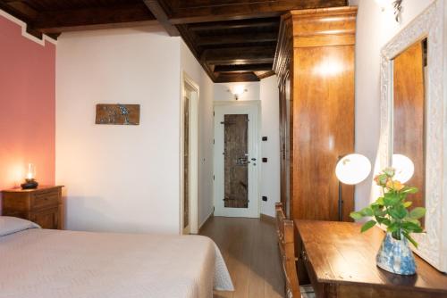 Postel nebo postele na pokoji v ubytování Dimora & Spa Il Cerchio di Lullo