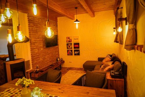 a living room with a couch and a table at Weinkeller Gehringer in Guntersdorf