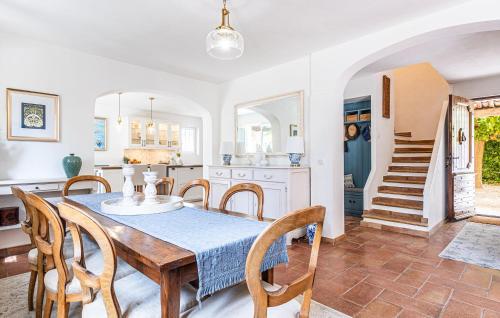 a kitchen and dining room with a table and chairs at Stunning Home In Callian With Wifi in Callian