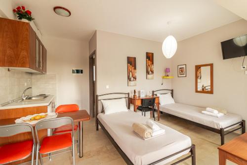 Ένα ή περισσότερα κρεβάτια σε δωμάτιο στο Erosaria Suites