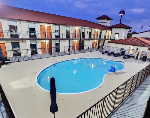 a large swimming pool in front of a building at SerenityStay Chattanooga Hamilton Place in Chattanooga