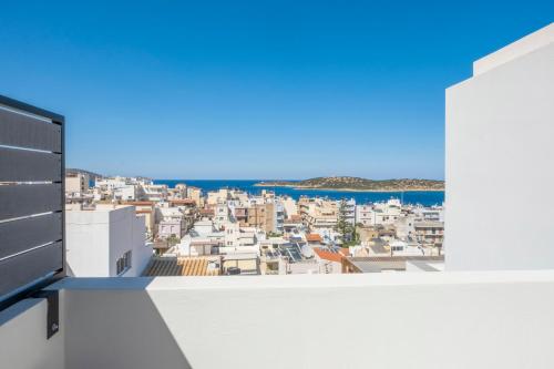 a view from a balcony of a city at Gioma Luxury Suites - Lake View - Jacuzzi in Agios Nikolaos
