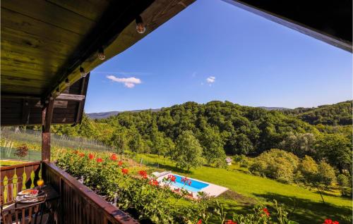a view from the balcony of a house with a swimming pool at Beautiful Home In Stubicke Toplice in Stubicke Toplice