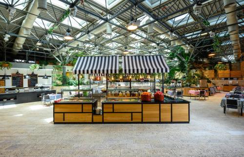 a store with a food counter in a building at Prima Park Hotel Jerusalem in Jerusalem