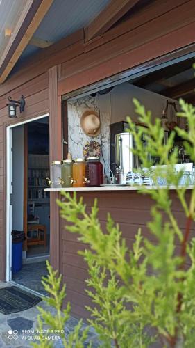 a window of a house with pots and pans at Orfeas Studios Molivos in Mithymna