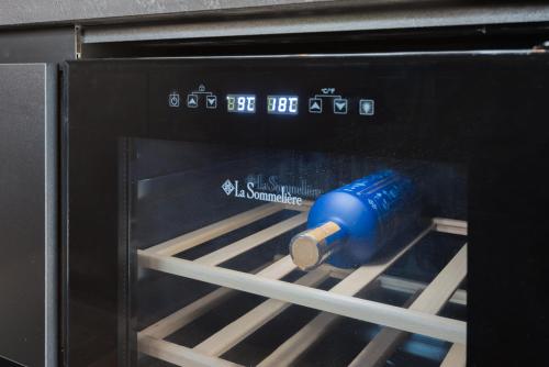 a blue cup is sitting inside of an oven at Emerald Stone Apartment Varkiza in Vari