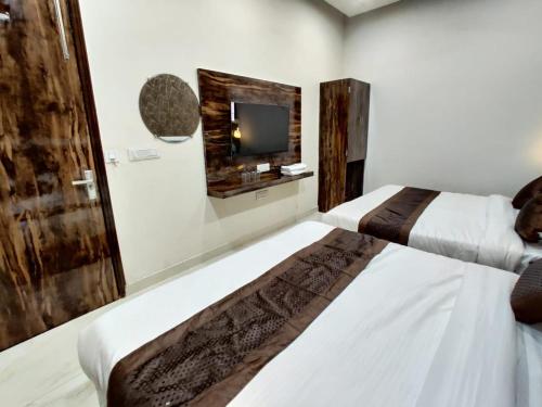 Voodi või voodid majutusasutuse Hotel GS Grand Amritsar toas