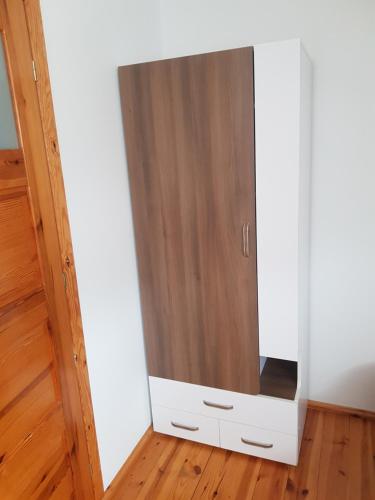a cabinet with a mirror in a room at Pokój 2osobowy in Swornegacie