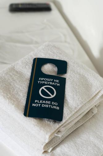 a book sitting on top of a bed at Готельно-ресторанний комплекс Традиція in Pistyn