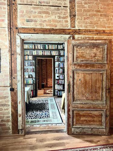 an entrance to a library with an open door at Romantic getaway apartment in Rakvere