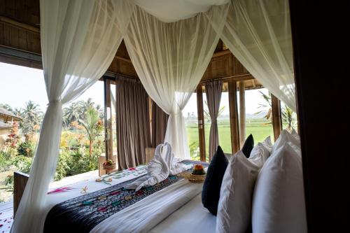 Ένα ή περισσότερα κρεβάτια σε δωμάτιο στο Padi Bali Retreat
