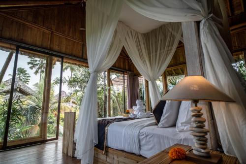 Ένα ή περισσότερα κρεβάτια σε δωμάτιο στο Padi Bali Retreat