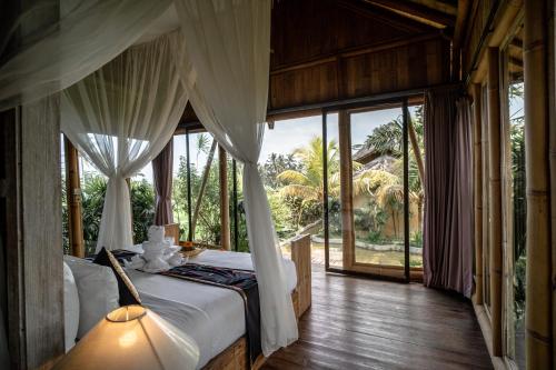 Ένα ή περισσότερα κρεβάτια σε δωμάτιο στο Padi Bali Retreat