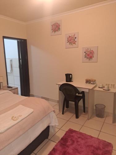 Ένα ή περισσότερα κρεβάτια σε δωμάτιο στο Akyra Guest House Brackenhurst