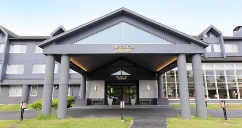 a building with the entrance to a building at Villa the Club Karuizawa in Naganohara
