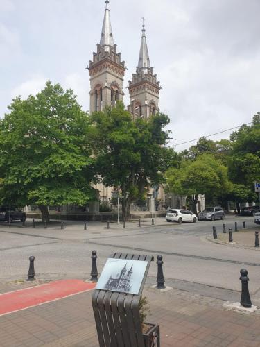 a bench with a drawing on it in front of a building at Terrace View in Batumi