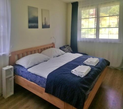 Postel nebo postele na pokoji v ubytování Apartmány Julinka