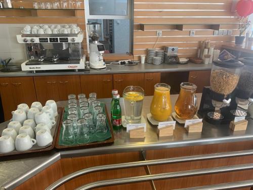a kitchen with a counter with drinks and a coffee maker at MEANDER THERMAL & SKI REZORT ORAVICE in Oravice