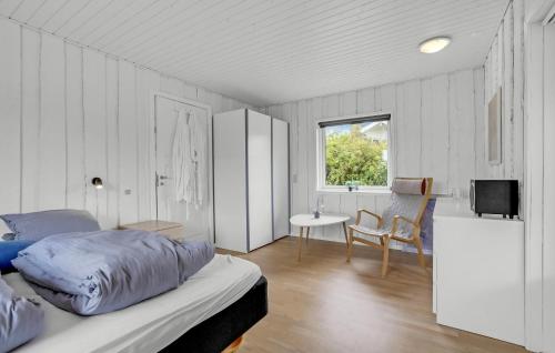 a bedroom with a bed and a table and a sink at Awesome Home In Kalundborg With Wifi in Kalundborg