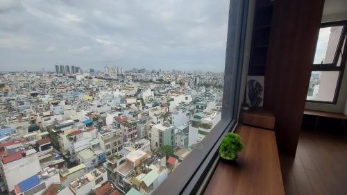 a view of a large city from a window at Vinh Hoi Apartments - Luxury Apartment Furnished Suites in Ho Chi Minh City