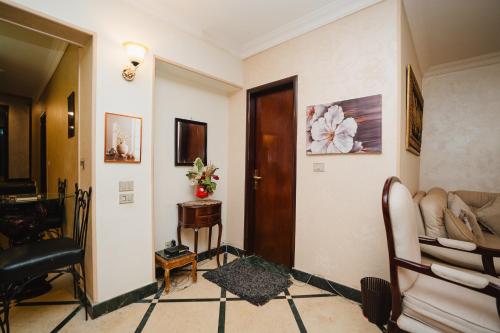 a living room with a couch and a table at Elegant Stay in Mohandessin in Cairo