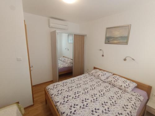 Postel nebo postele na pokoji v ubytování Apartments Tomi