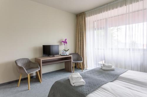 Postel nebo postele na pokoji v ubytování Hotel Hera
