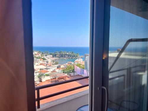 a view of the ocean from a room with a window at Apartments Aga in Ulcinj