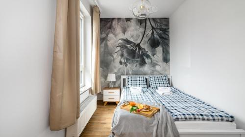 Ένα ή περισσότερα κρεβάτια σε δωμάτιο στο TRIMARE Apartamenty Piamola