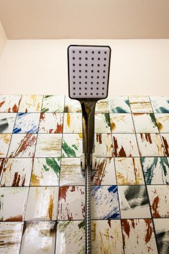 a spatula sitting on top of a tiled floor at iVAVev IS US ByTheSea EforieSud in Eforie Sud