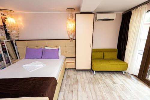 a small room with a bed and a chair at iVAVev IS US ByTheSea EforieSud in Eforie Sud