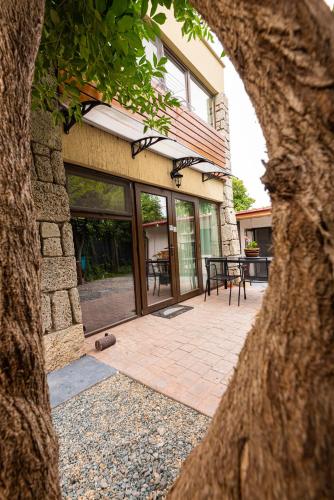 a building with glass doors and a patio at iVAVev IS US ByTheSea EforieSud in Eforie Sud