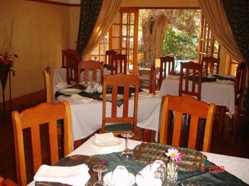 En restaurang eller annat matställe på Cecil John Rhodes Guest House