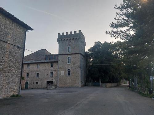 a large castle with a tower on top of it at Suite Morruzze in Morruzze
