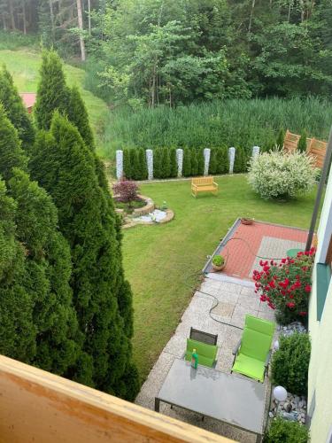 an aerial view of a garden with green chairs at Ferienwohnung Marianne in Annaberg im Lammertal