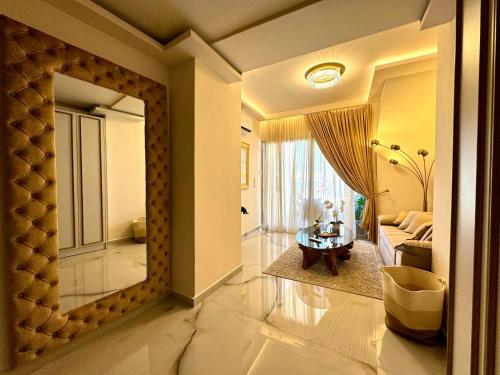 a room with a living room with a table and a couch at Mare Suites 4 in Chania