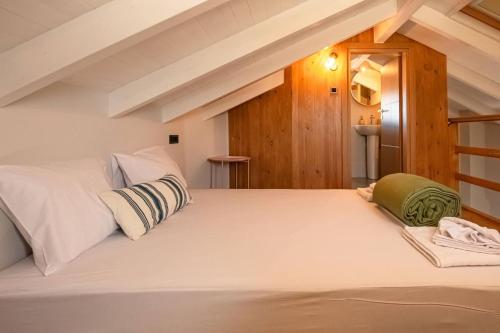 a bedroom with a large white bed in a room at Filitsa's Luxury House in Chania Town