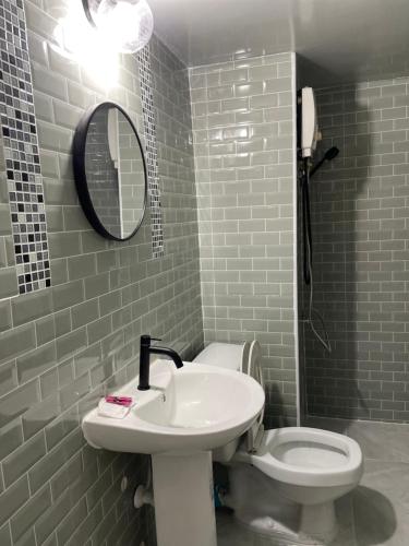 a bathroom with a sink and a toilet at Dailyroom C3,C4by Anna in Nonthaburi