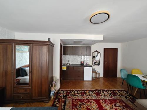 a living room with a kitchen and a dining room at Beatrix Suites in Budva