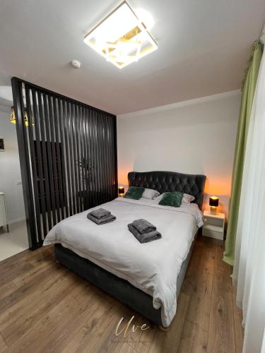 Ένα ή περισσότερα κρεβάτια σε δωμάτιο στο Uve Residence & Spa