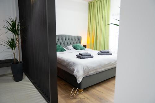 Ένα ή περισσότερα κρεβάτια σε δωμάτιο στο Uve Residence & Spa