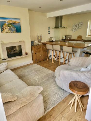 a living room with a couch and a table at Conwy Castle cottage in Conwy