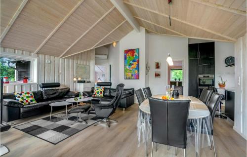 a living room with a couch and a table at Lovely Home In Hobro With Wifi in Hobro