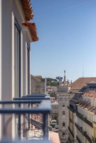 a view of a city from a balcony at Boutique Chiado Suites in Lisbon